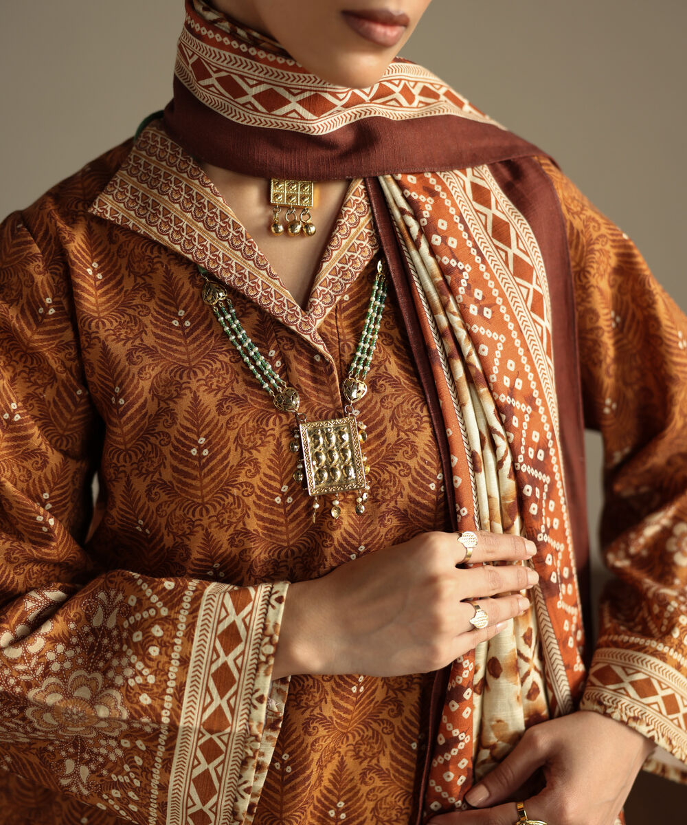 Women's Unstitched Khaddar Printed Orange 3 Piece Suit