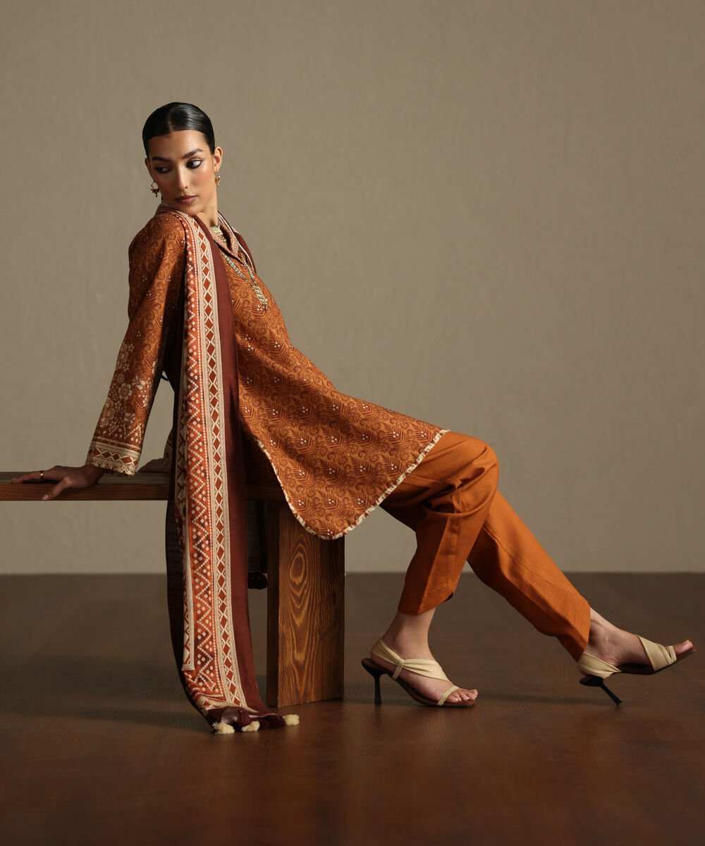 Women's Unstitched Khaddar Printed Orange 3 Piece Suit