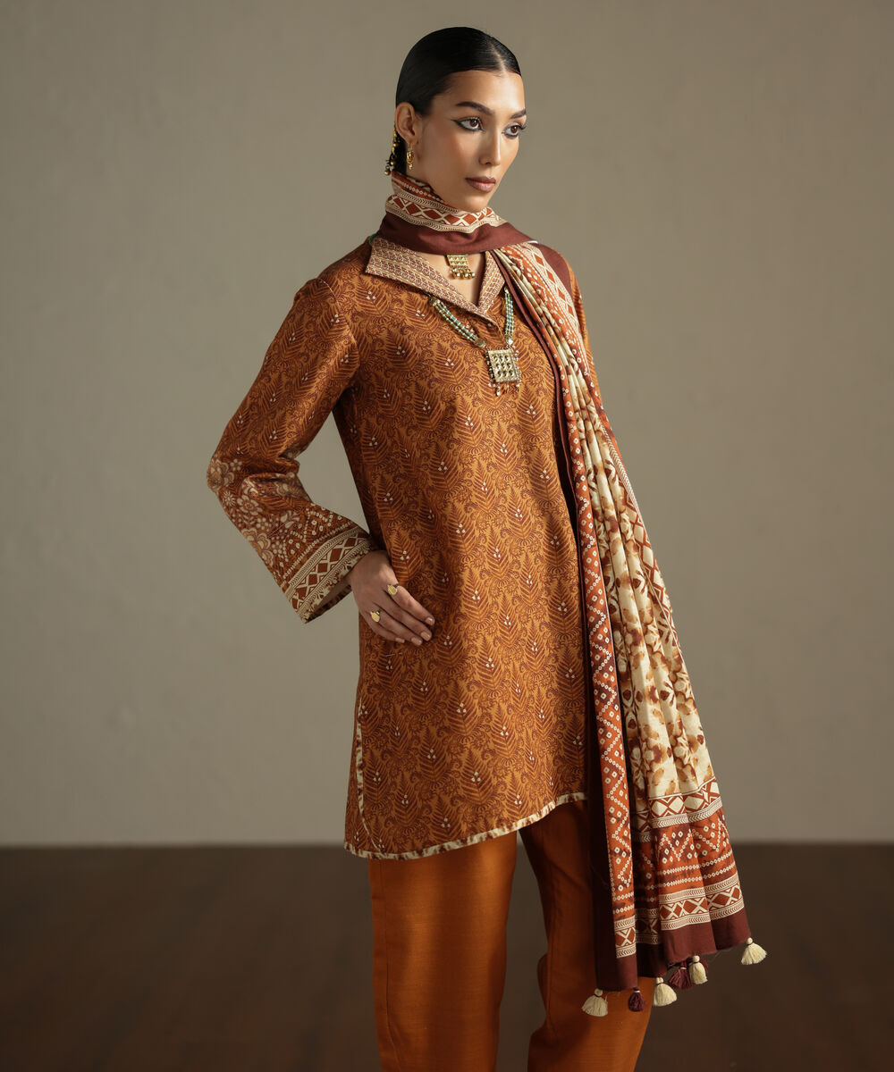 Women's Unstitched Khaddar Printed Orange 3 Piece Suit